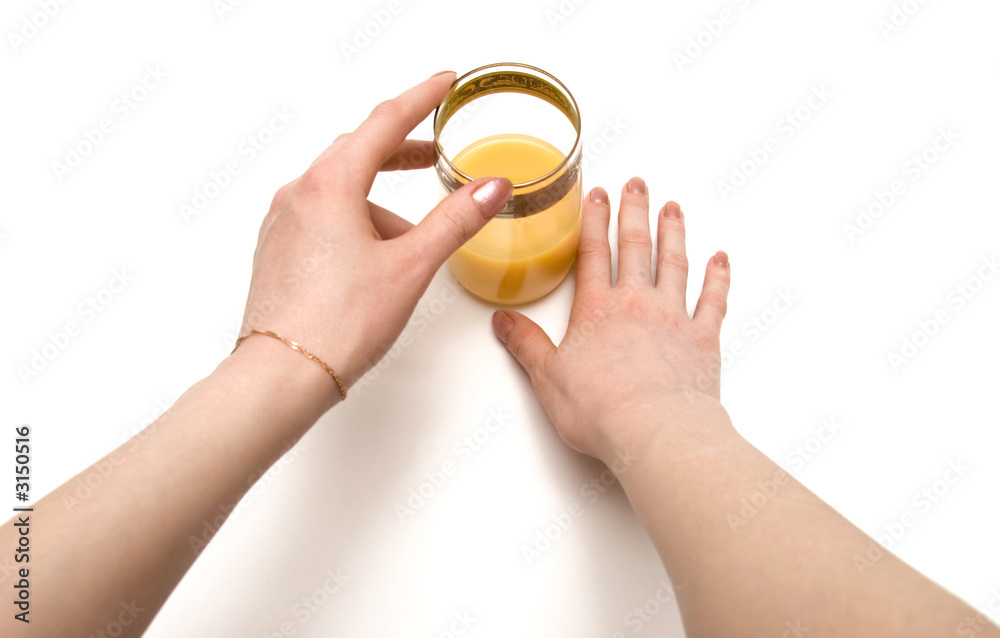 woman holding glass of juice