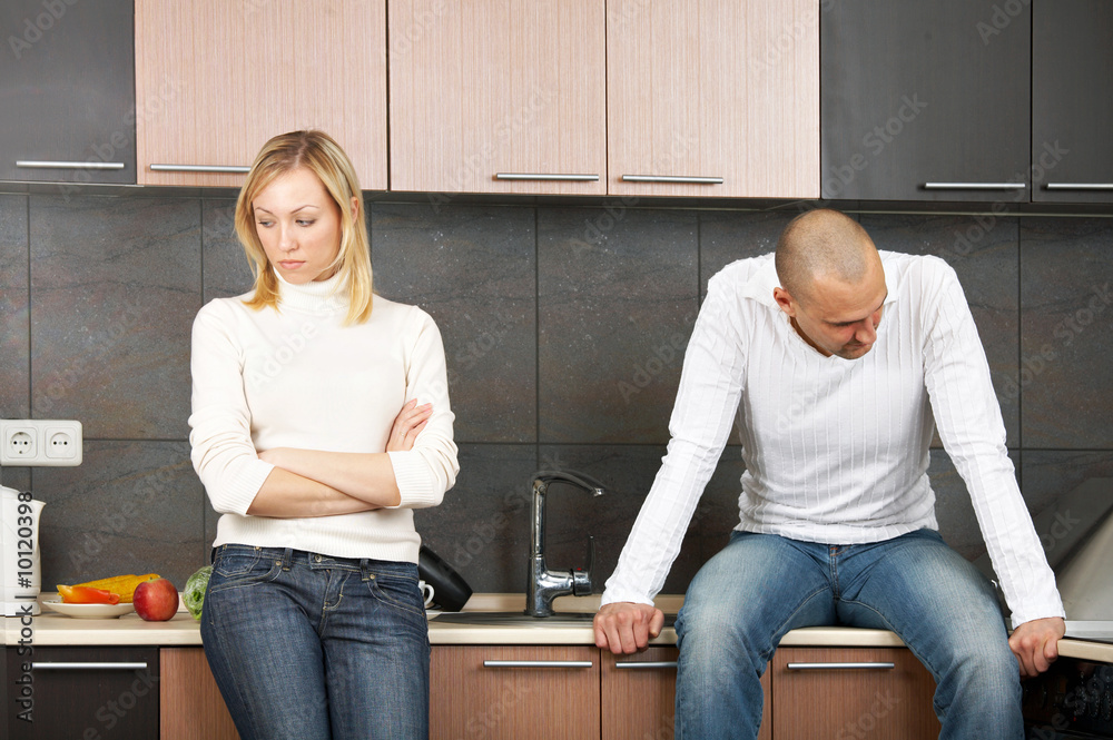 The image of quarrel of a married couple on kitchen