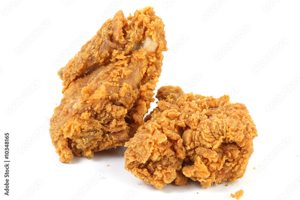 two pieces of unhealthy fries chicken on white background