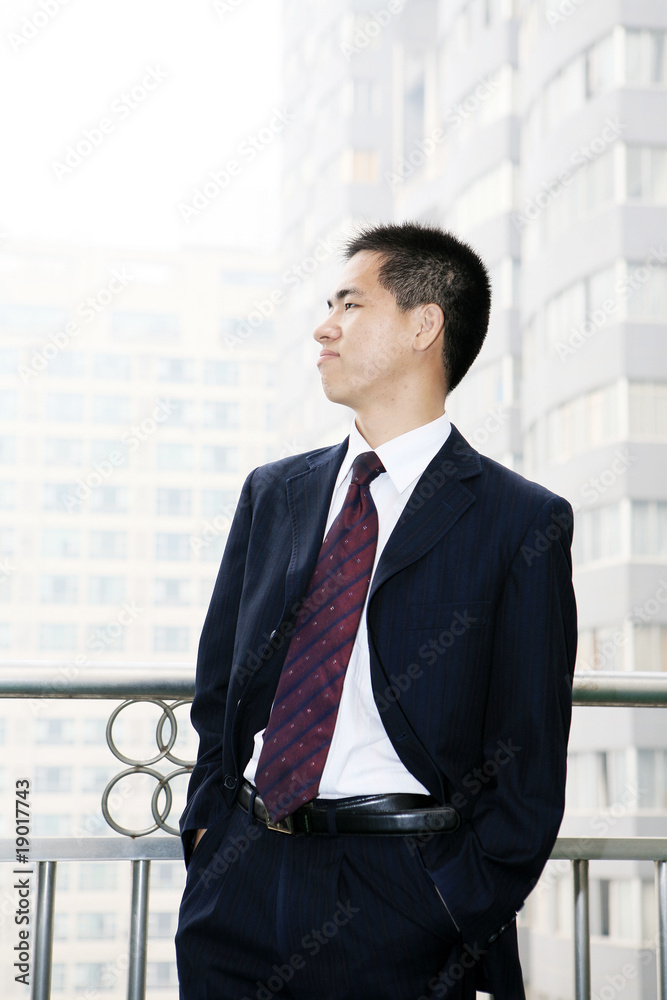 young asian businessman on the balcony