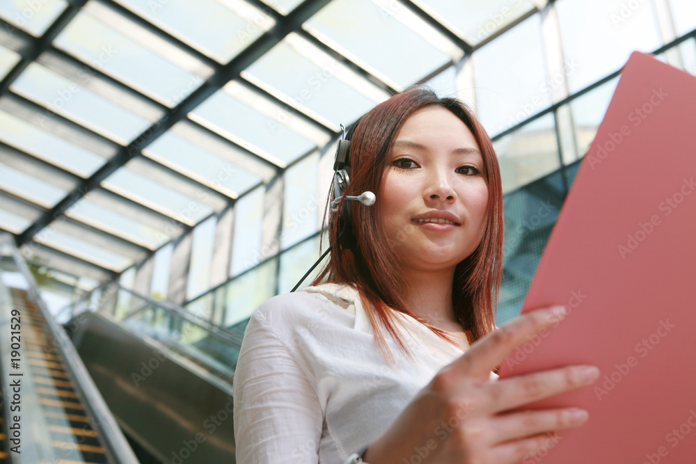 asian Customer Representative holding with folder