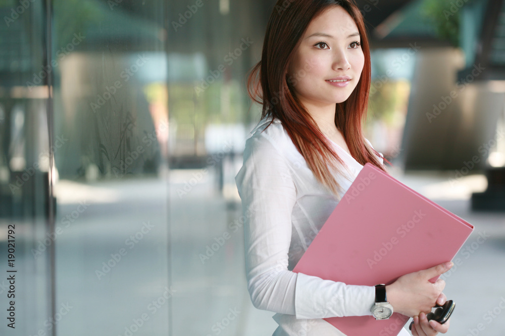 Beautiful Customer Representative holding with folder