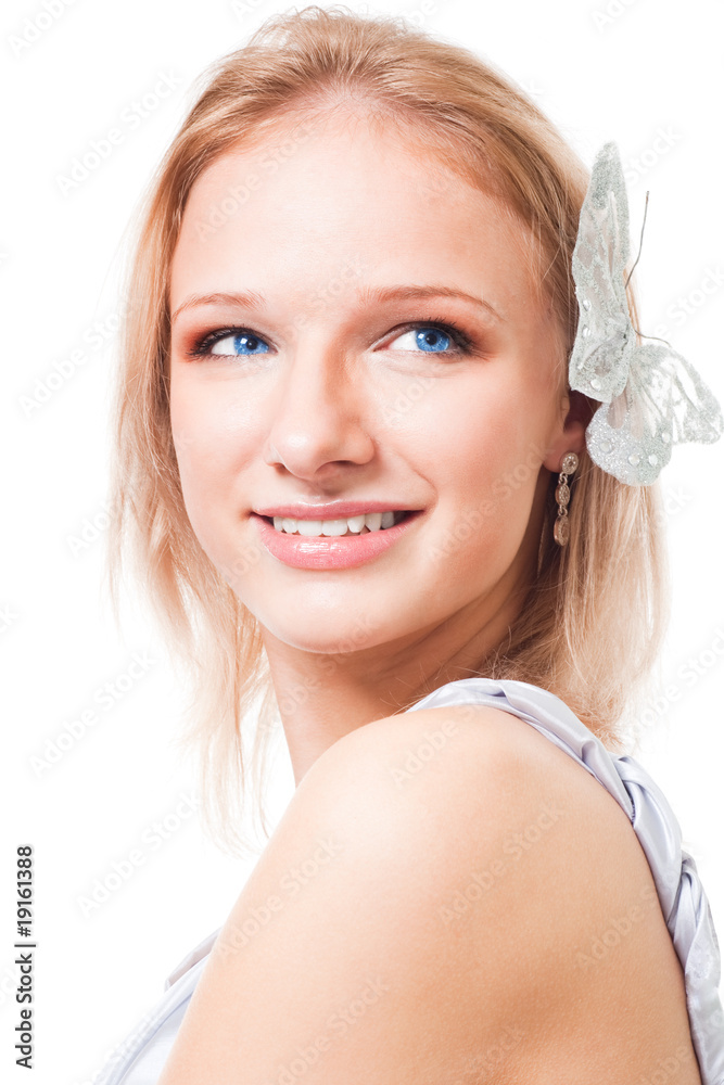 Blond woman with butterfly in her hair smile