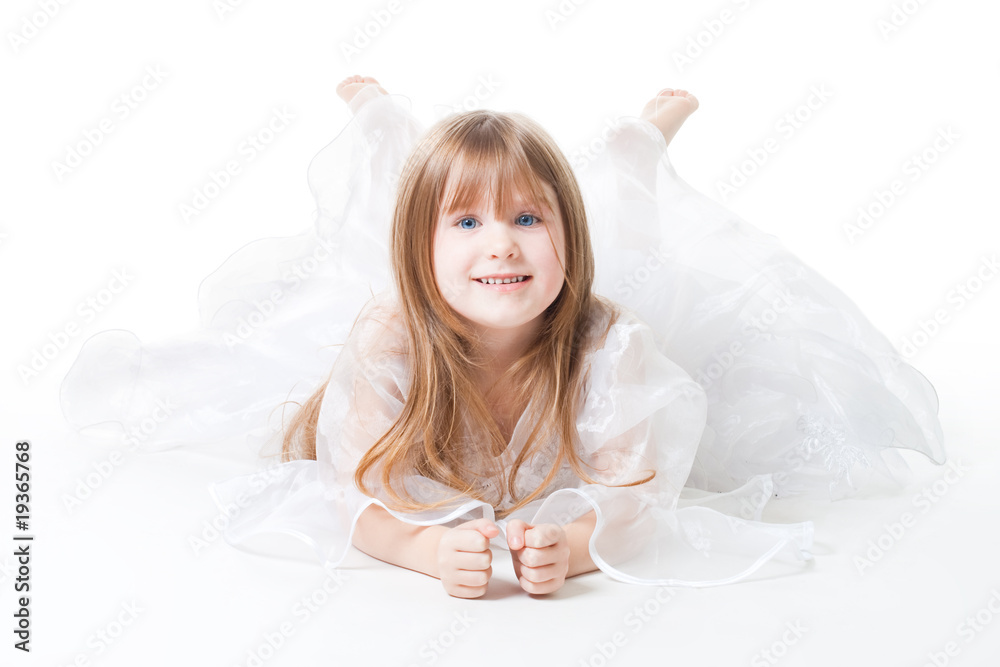 Little girl wear dress lay on the floor