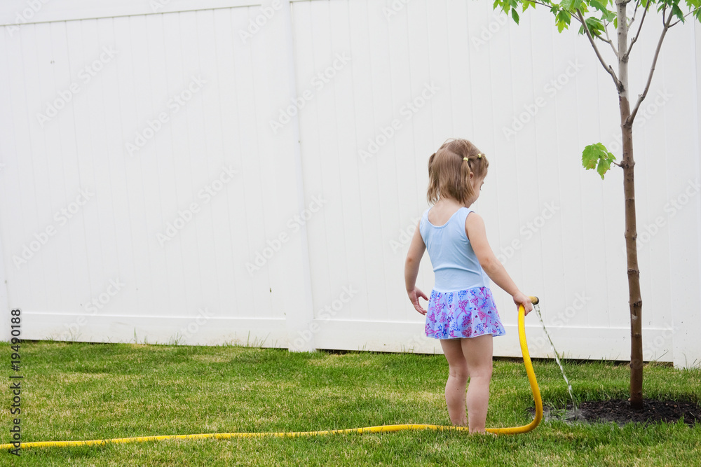 Child Helping a tree grow