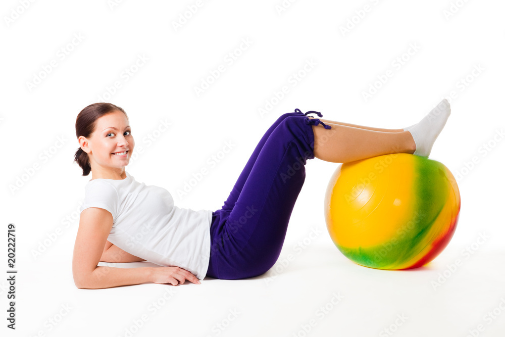 Woman doing fitness exercises with ball