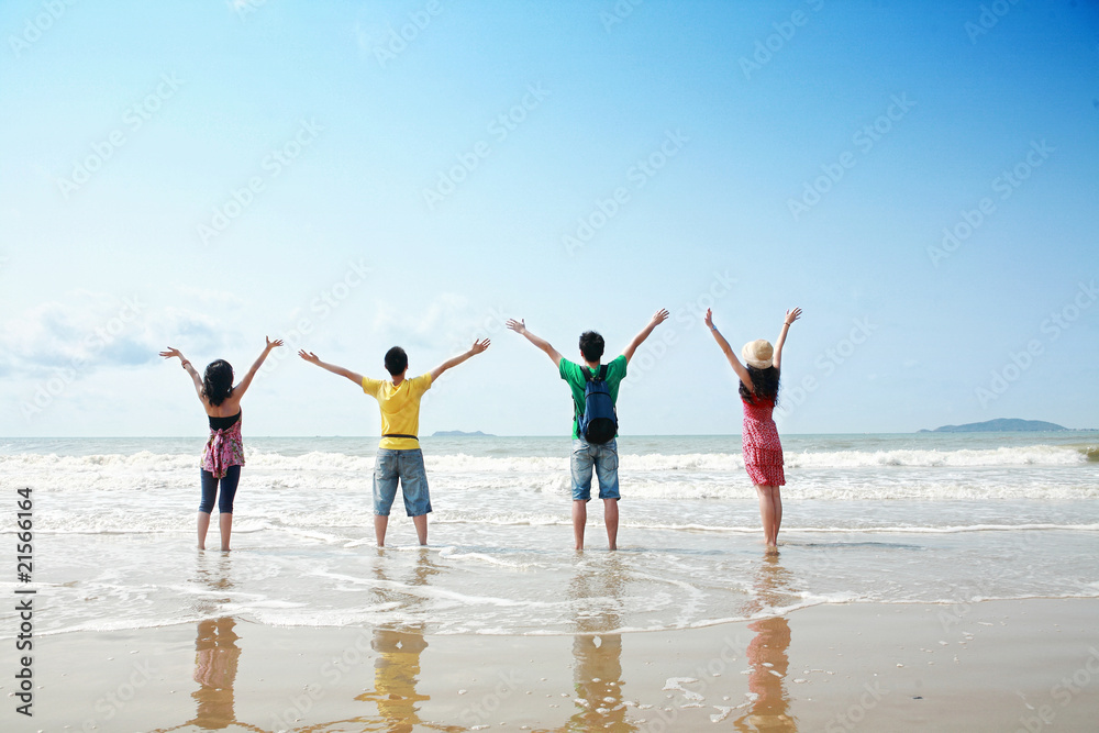 friends holding togehter on beach