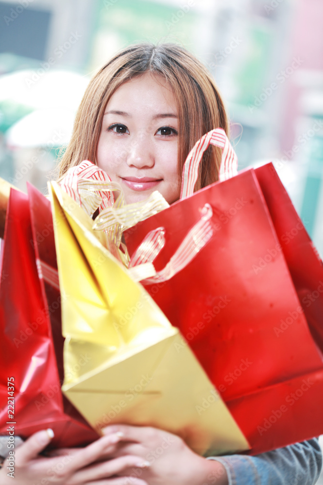 asian girl with shopping bags