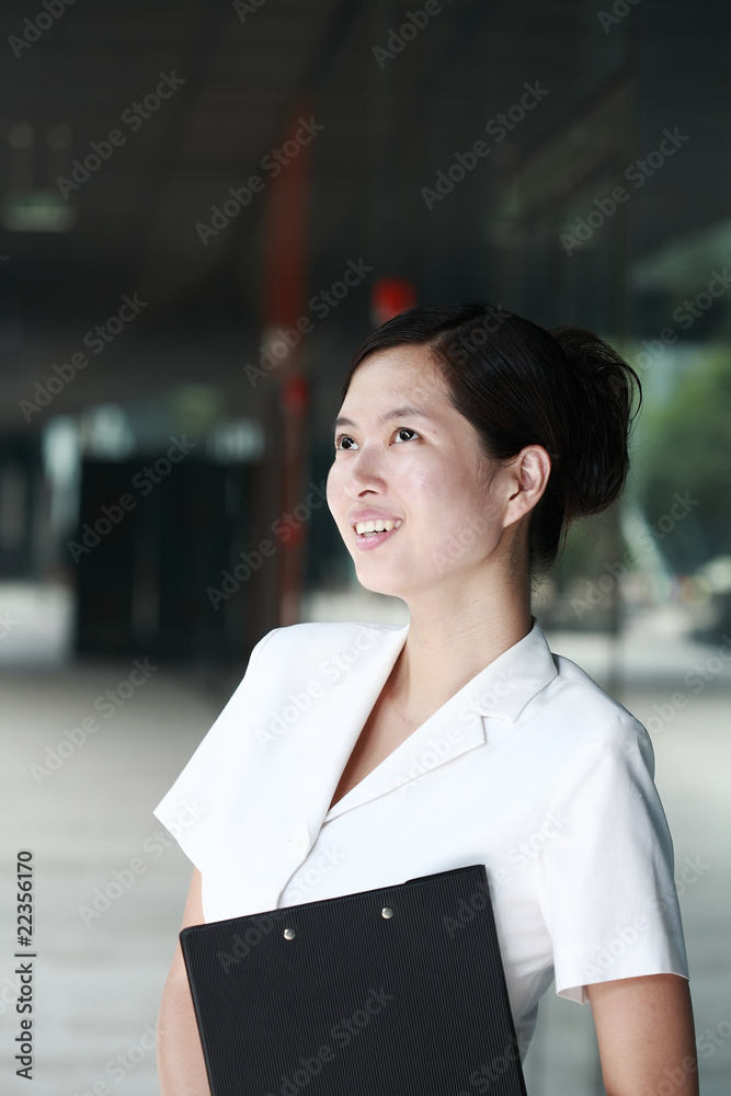 young asian business woman holding with folder