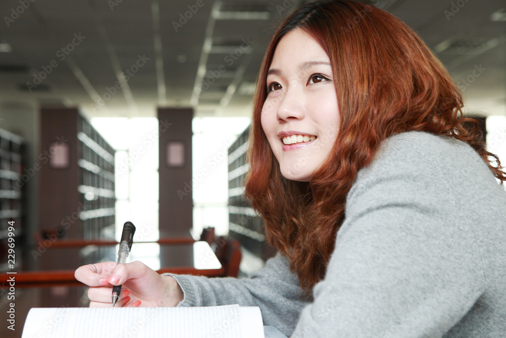 asian girl studying in library