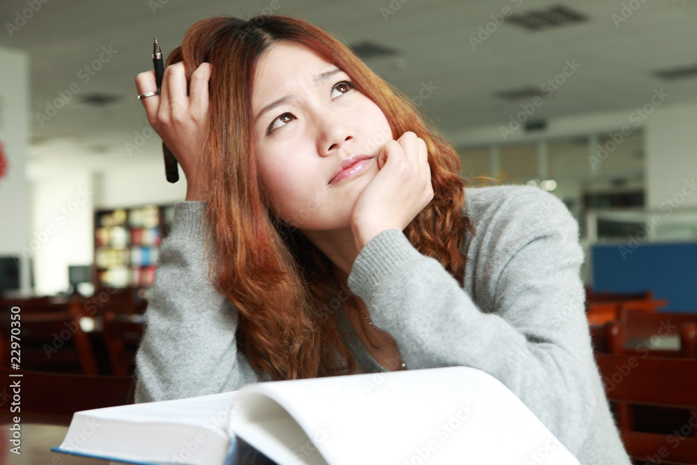 asian girl studying in library