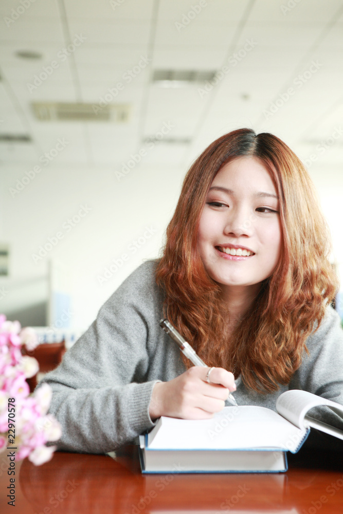 asian girl studying in library