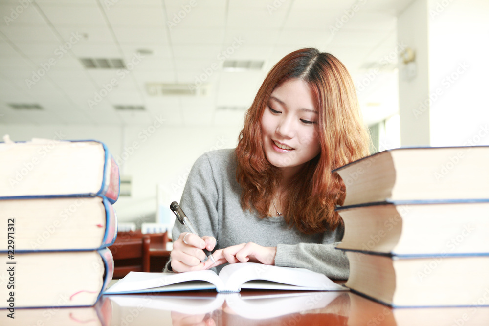 asian girl studying in library