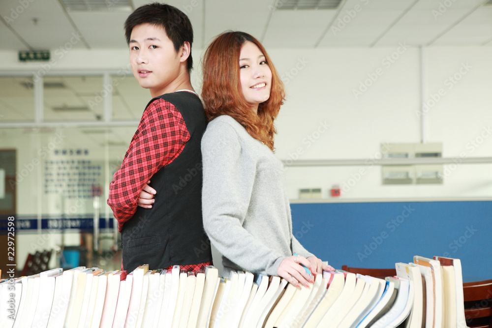 asian boy and girl in library