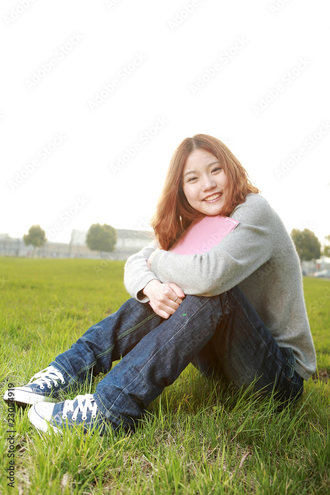 asina reading book on grass