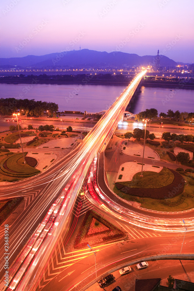 traffic on night road junction with long exposure .