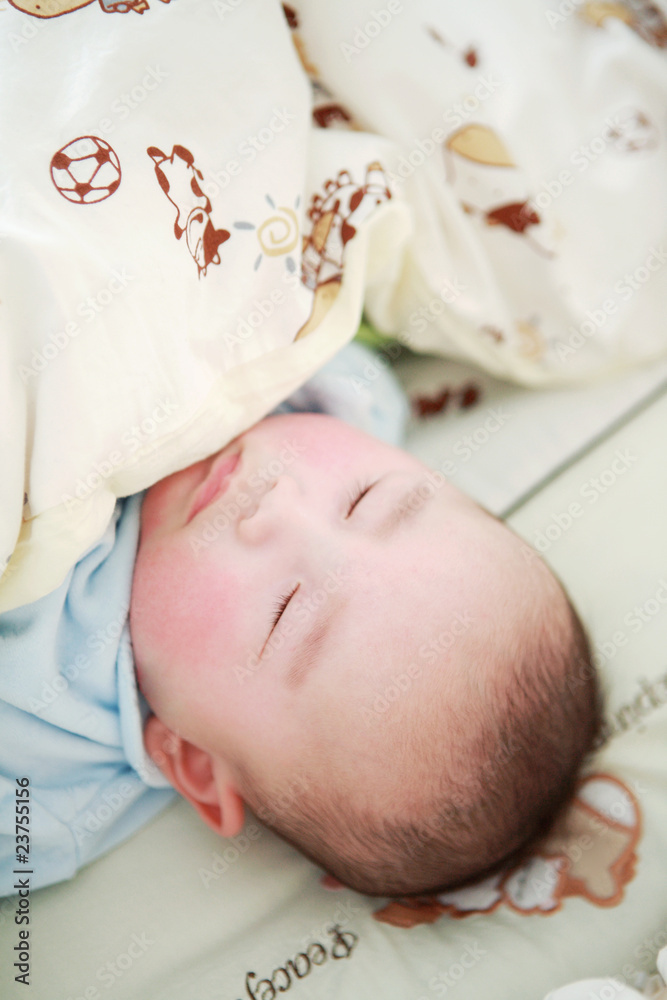 closeup of Cute little baby sleeping in bed