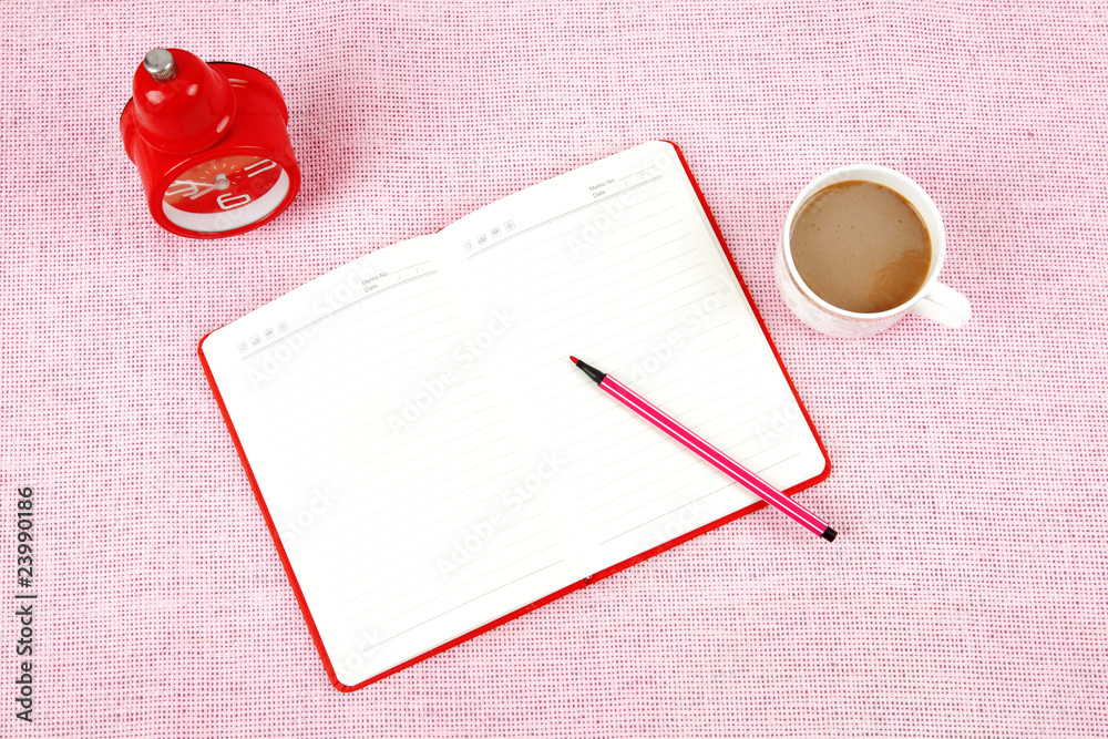 Clutter of objects stacked on pink background