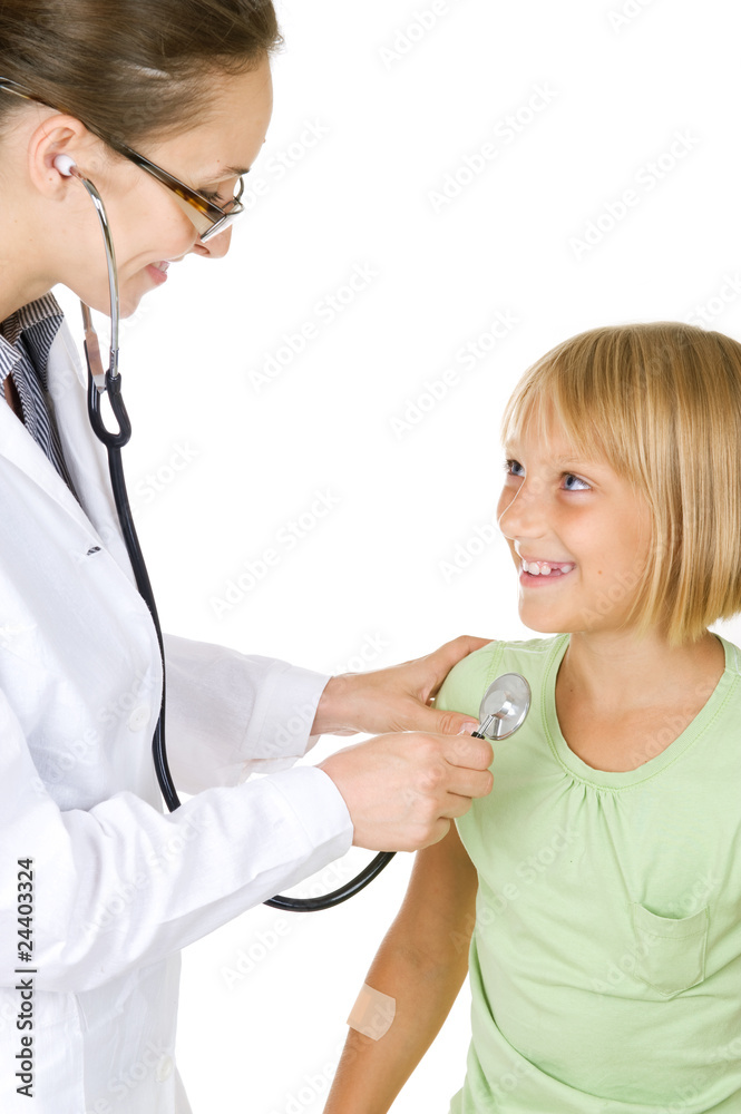 Doctor examining little child girl