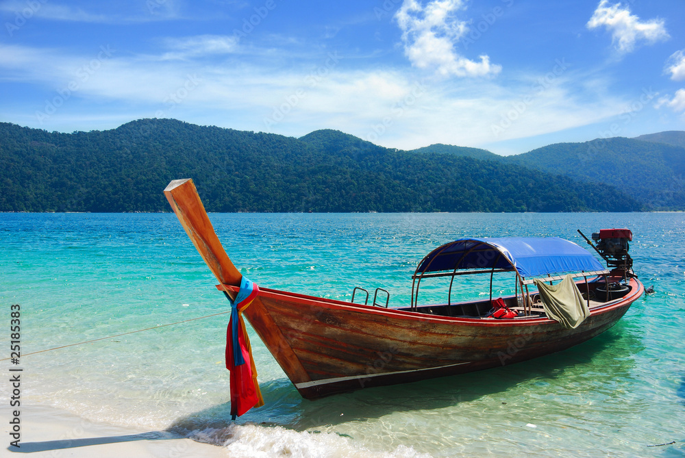 Traditional Thai longtail boat at the beach, Rawi island, Thaila