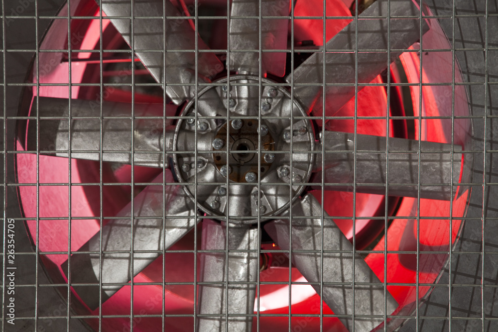 Industrial fan with a metal grate,