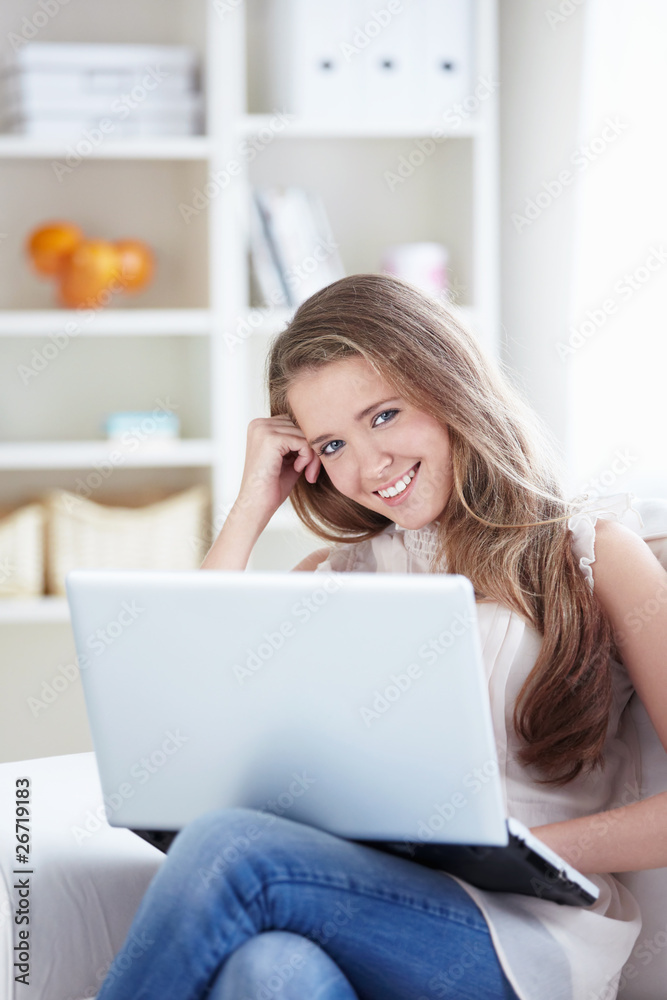 Beautiful girl with a laptop at home