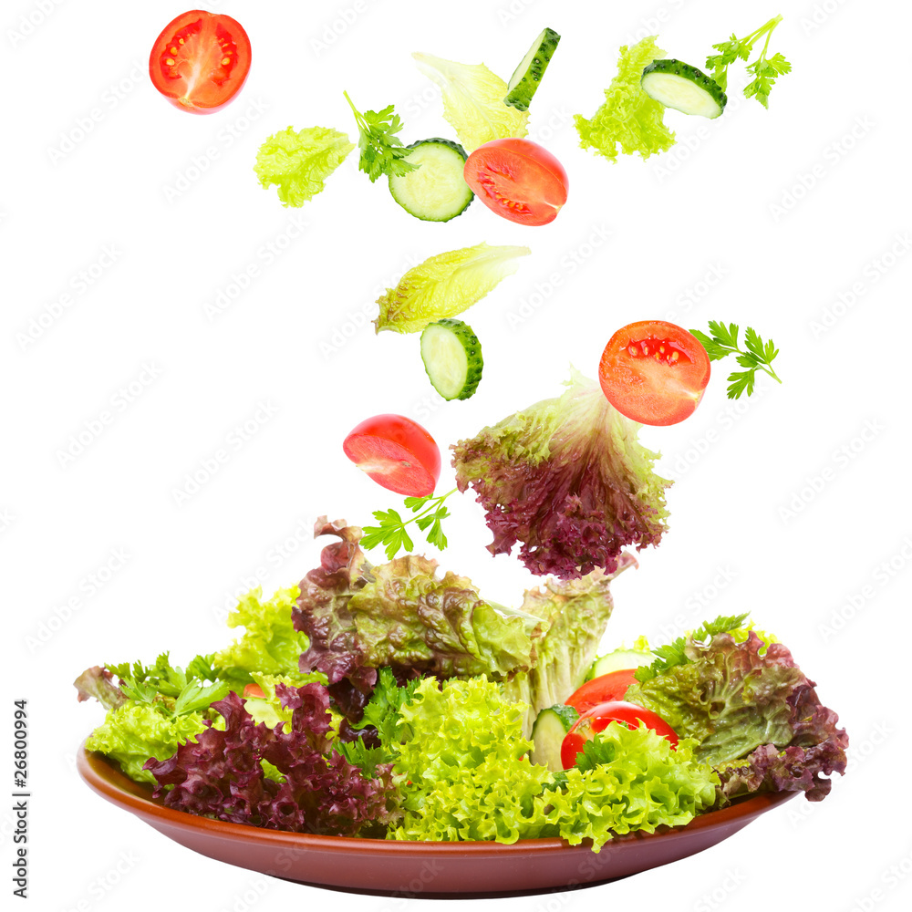 Fresh Vegetables falling in a plate