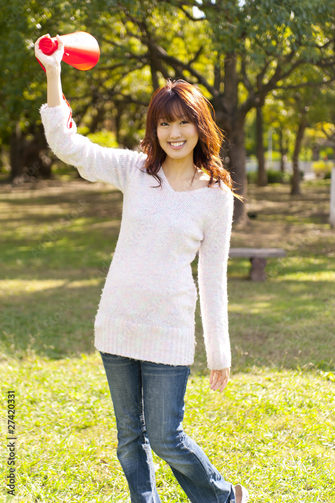 a portrait of young woman cheering