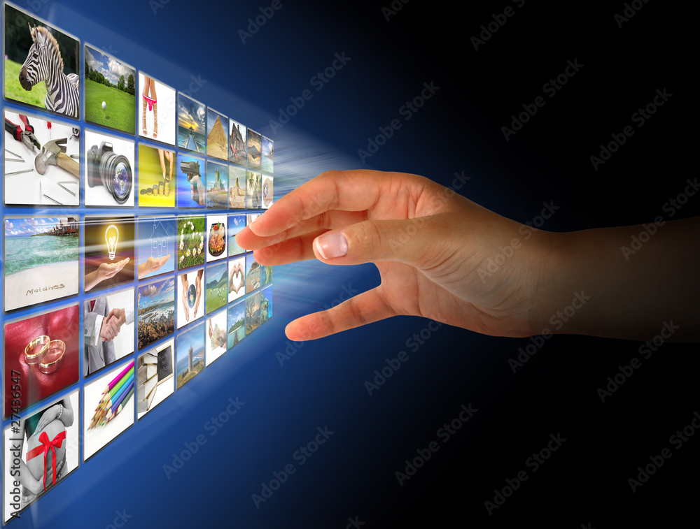 Woman hand reaching images on the screen