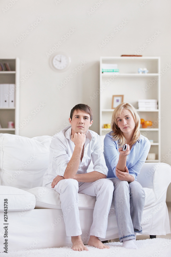 Young couple watching TV