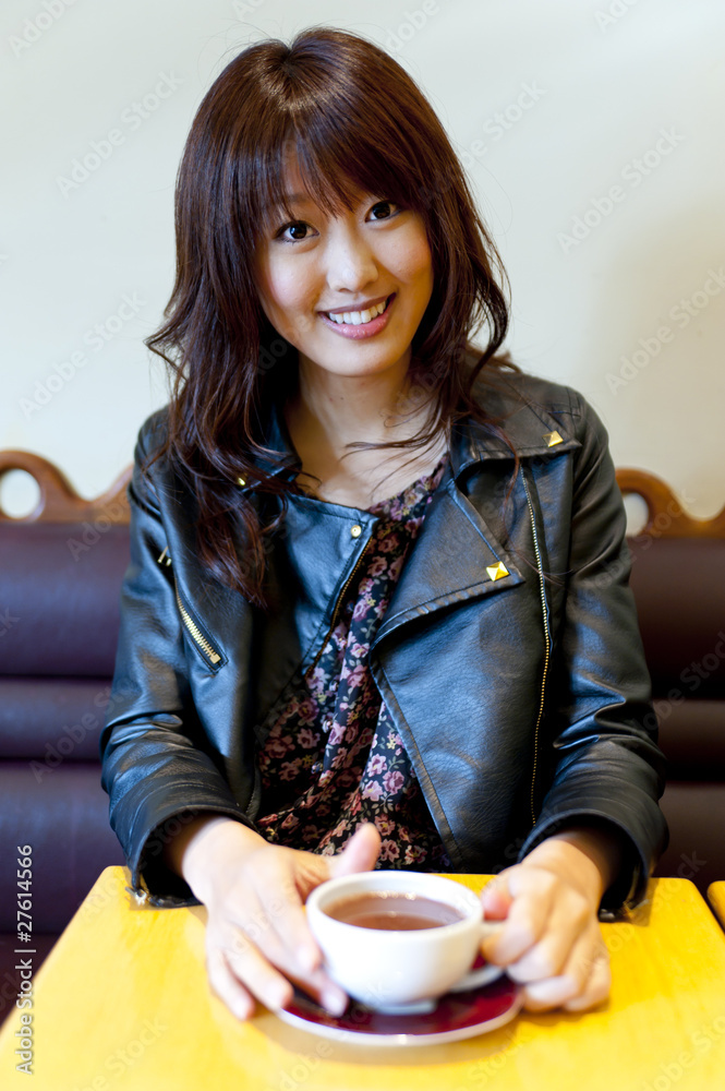 a portrait of young woman in the cafe