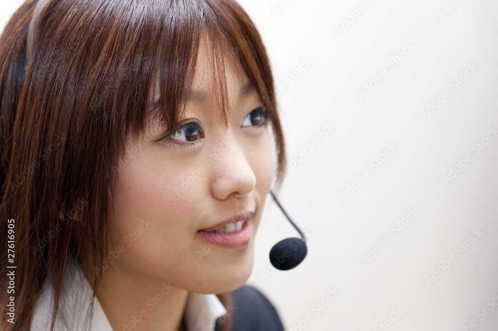 a portrait of young business woman with haedset