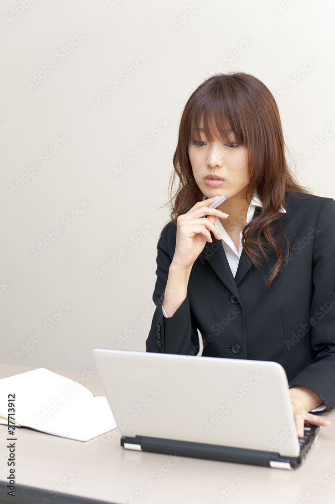 a portrait of young business woman on the desk