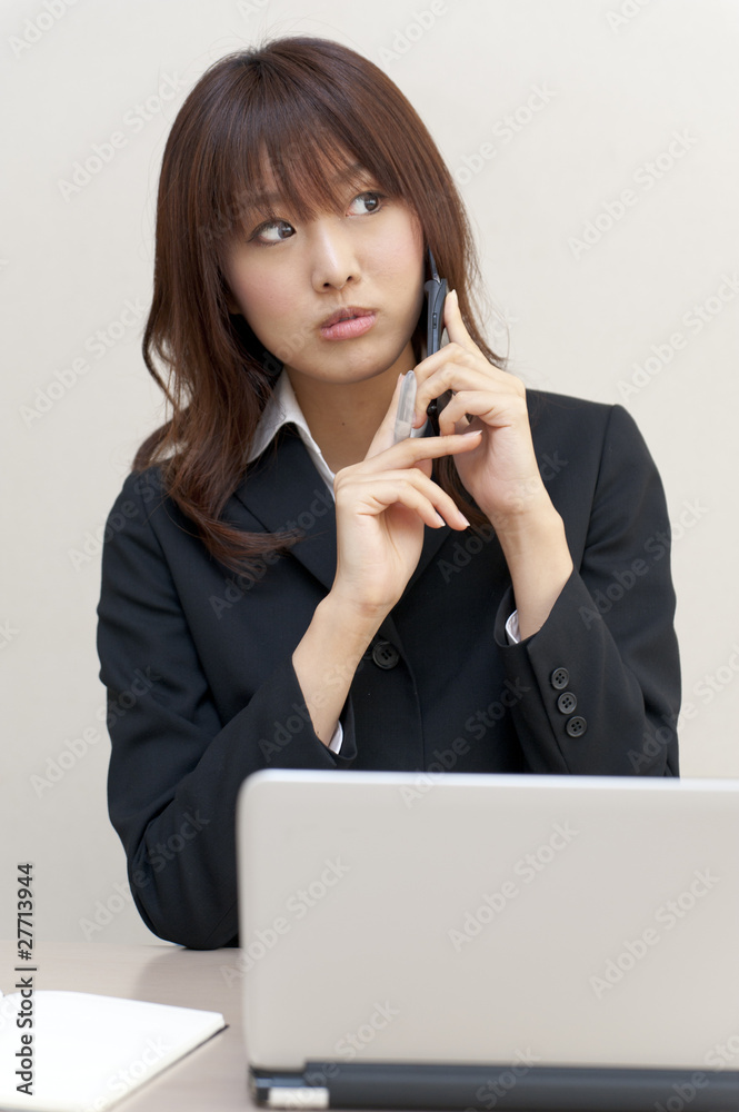 a portrait of young business woman on the desk