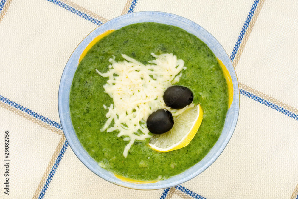 spinach soup, cheese, olives, lemon