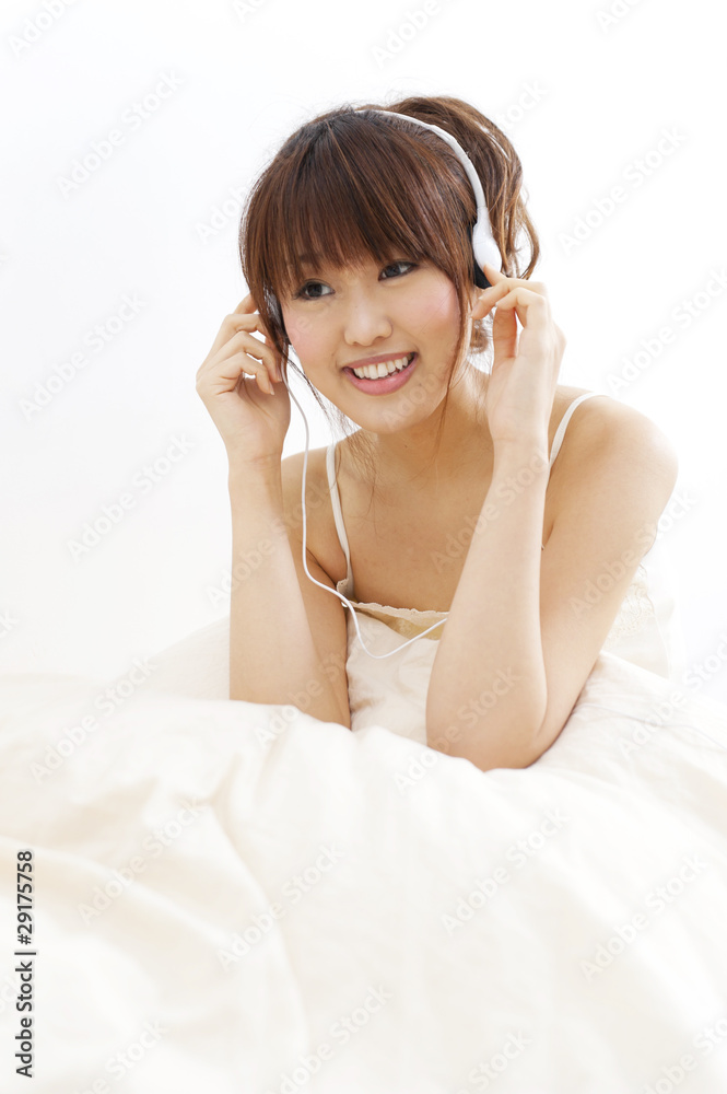 a portrait of beautiful asian woman on the bed