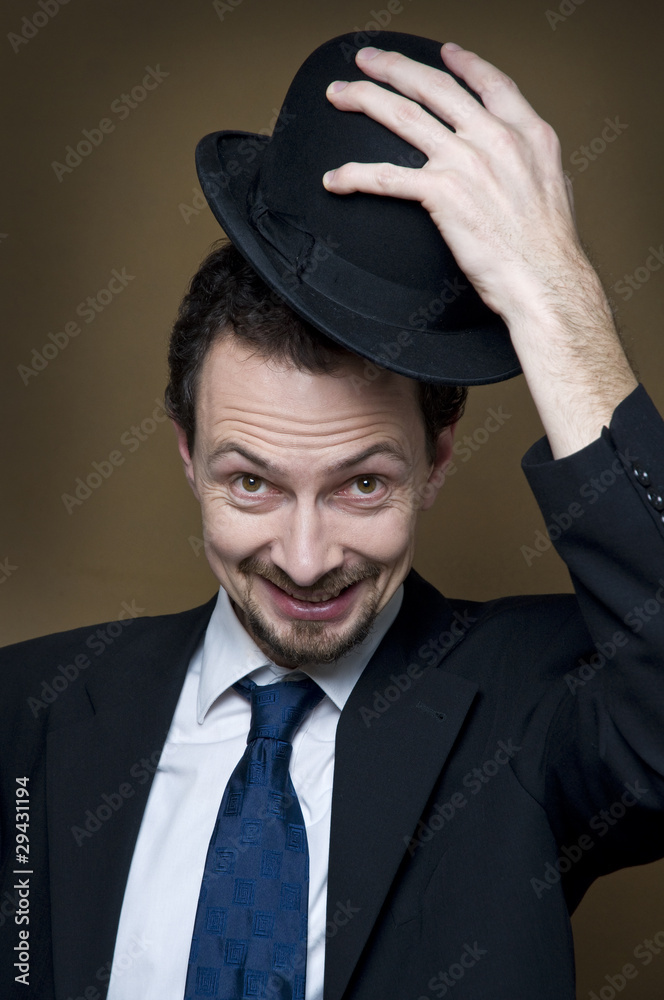 Happy businessman with bowler