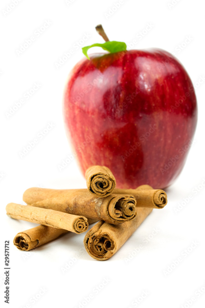 Apple and cinnamon sticks isolated on white