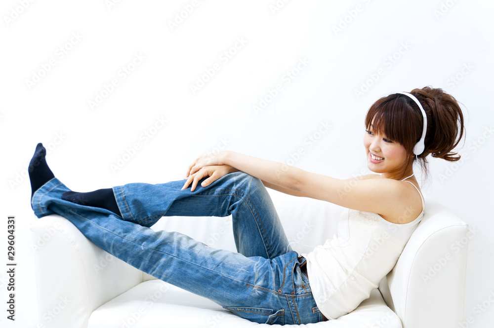 a portrait of beautiful asian woman listening a music