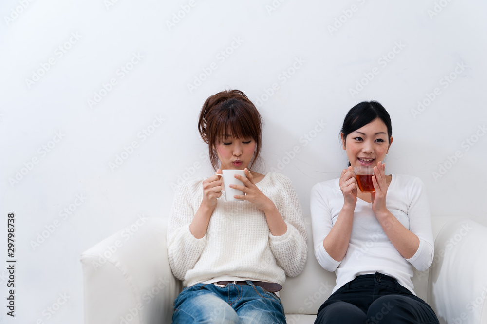 beutiful asian women relaxing on the sofa