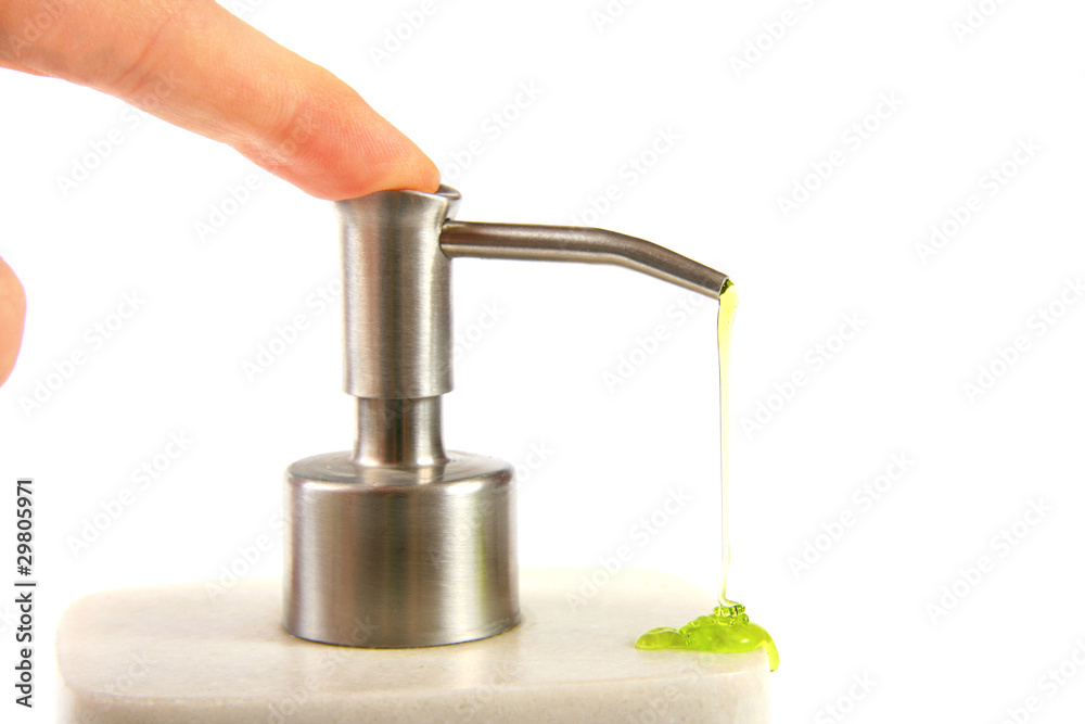 finger pushing liquid soap pump