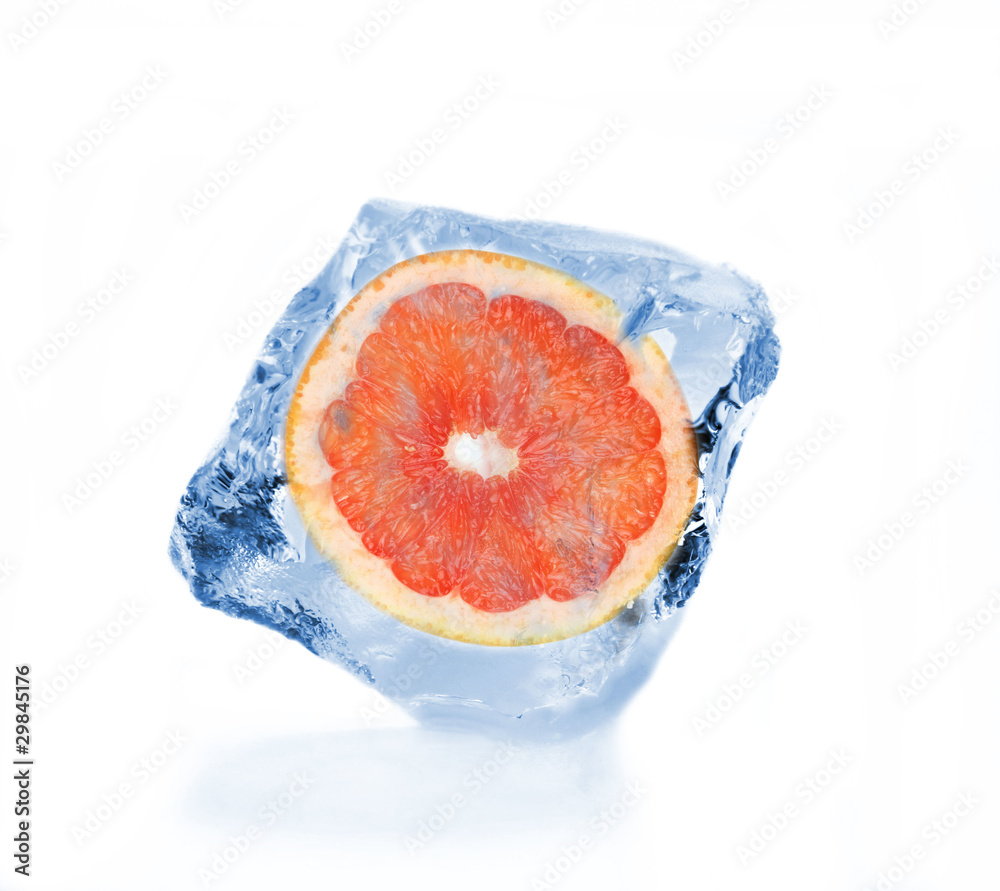 Frozen slice of grapefruit in ice cube