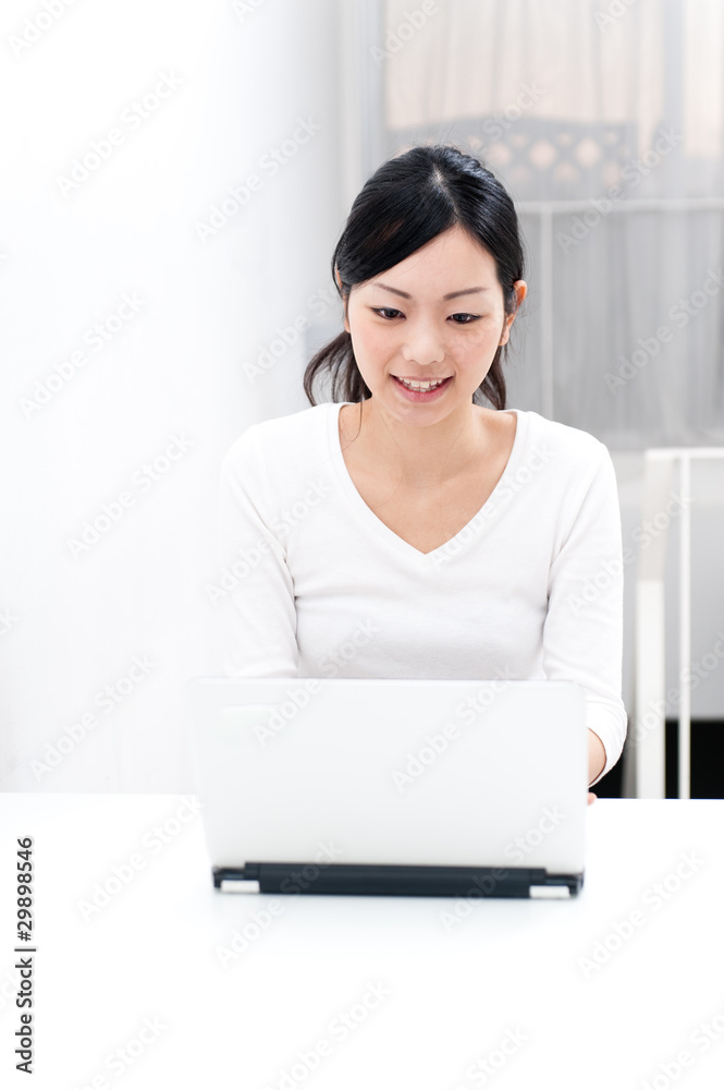 beautiful asian woman using laptop