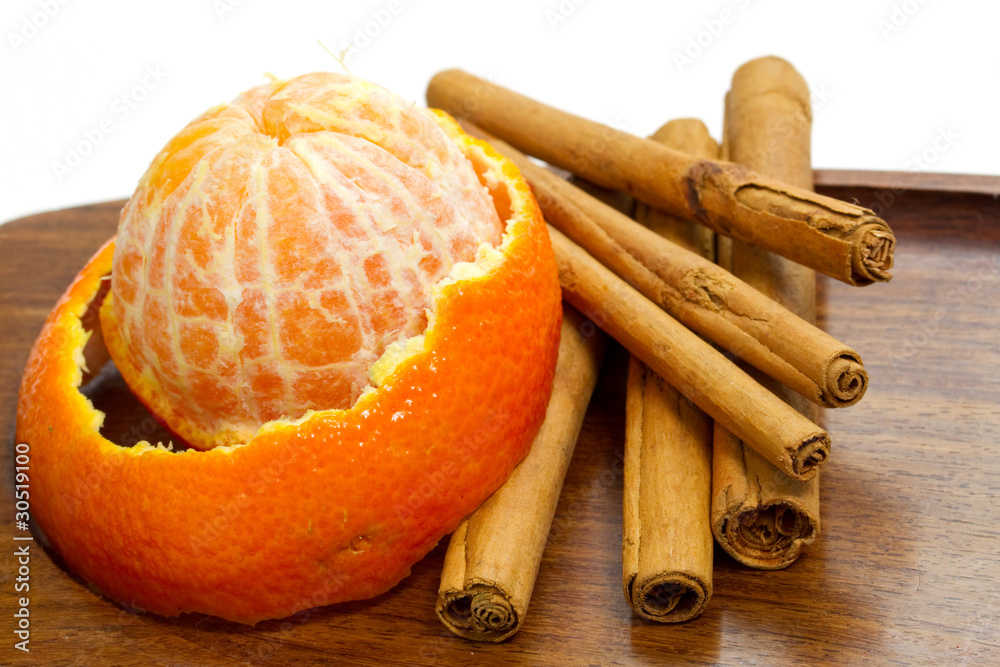 Orange with cinnamon sticks