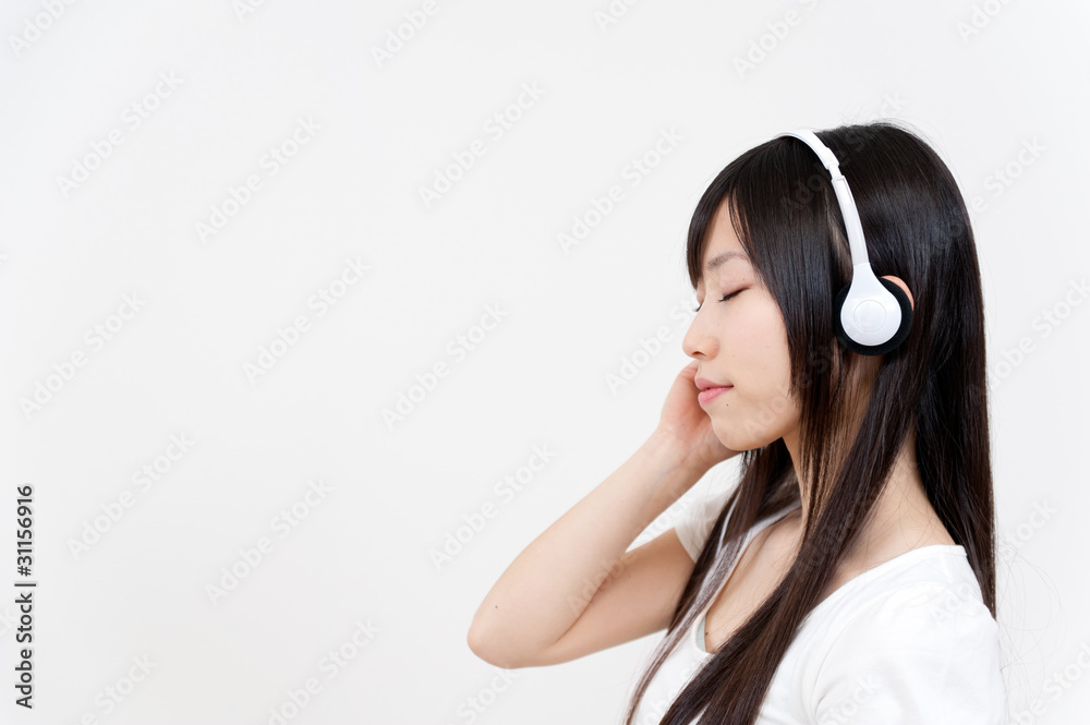 beautiful asian woman listening music