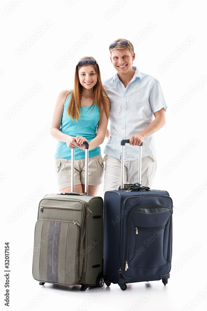 Young couple with suitcases