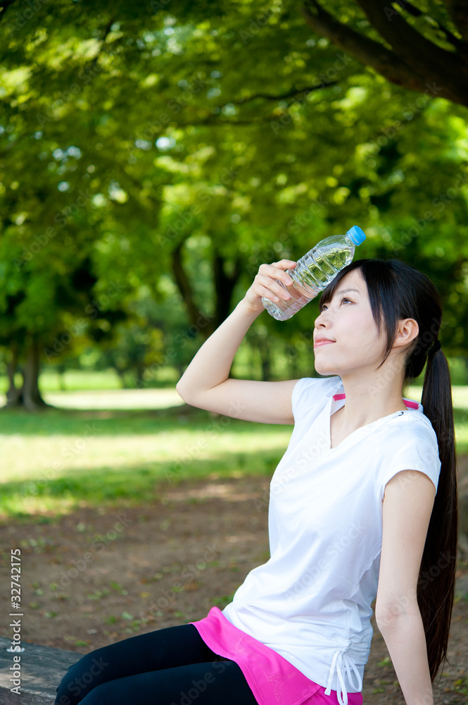 beautiful asian woman relaxing in the park