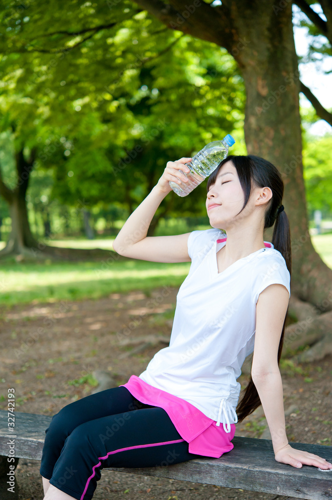 beautiful asian woman relaxing in the park