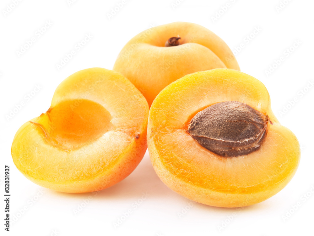 Apricot fruits with leaves isolated on white background