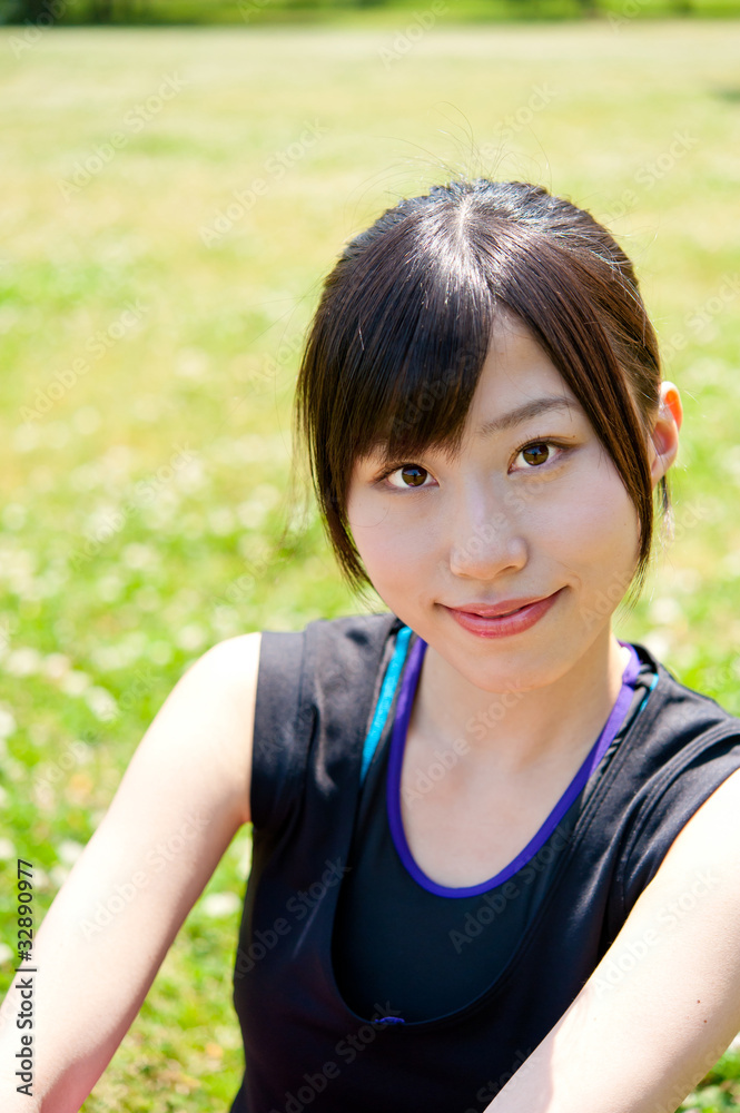 beautiful asian woman sitting in the park